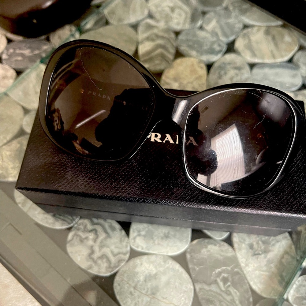Prada black sunglasses gold logo on sides
